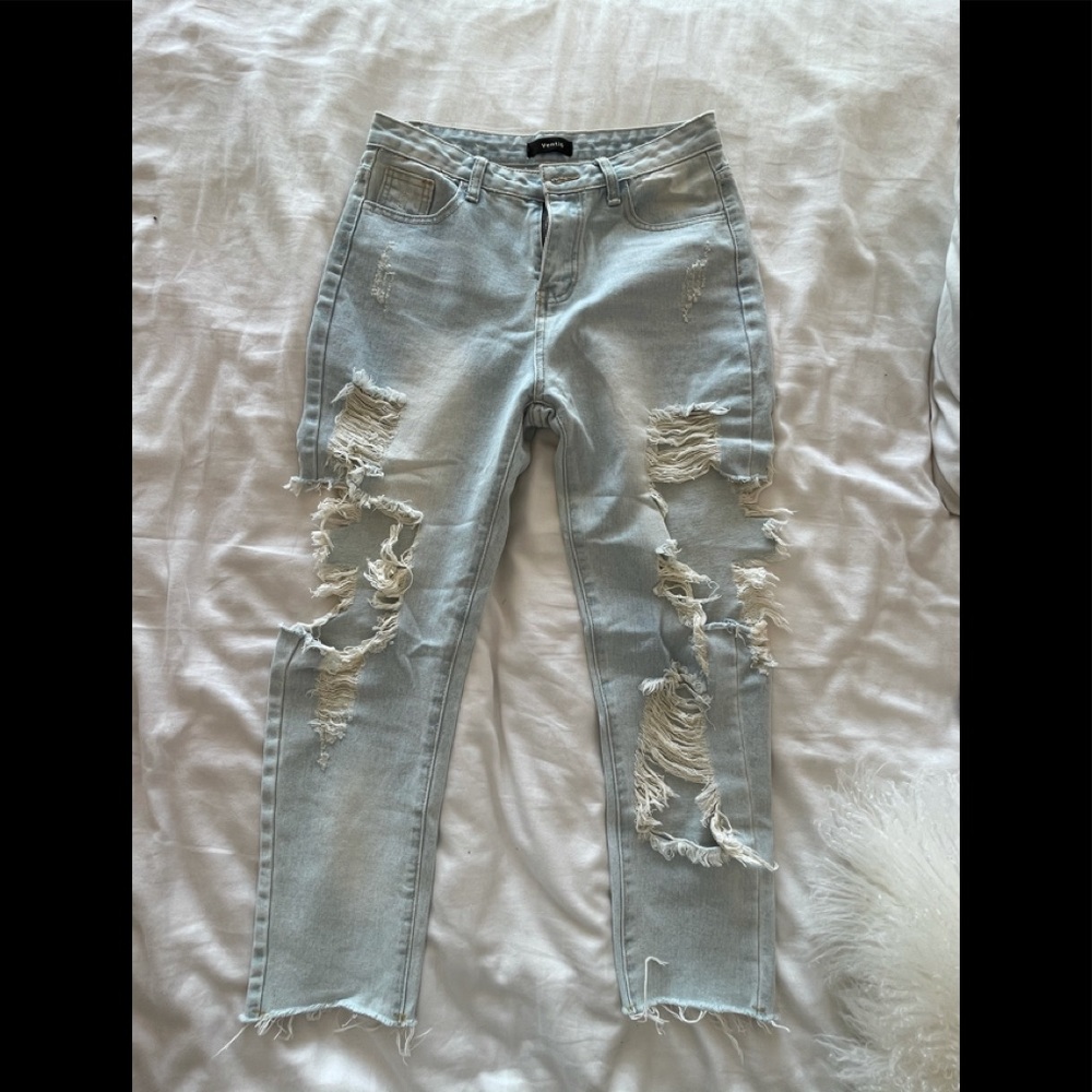Super distressed, light wash boyfriend jean